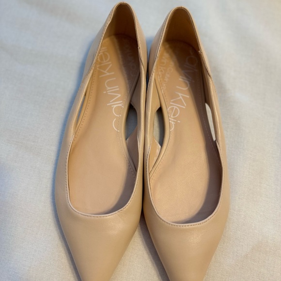 Calvin Klein Shoes - Calvin Klein cream-tan flats